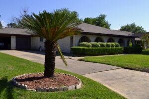 unlevel concrete slab in driveway needs replacement from Houston concrete supplier